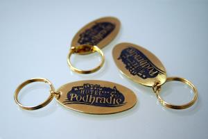 Mosadzné kľúčenky s logom hotela Podhradie